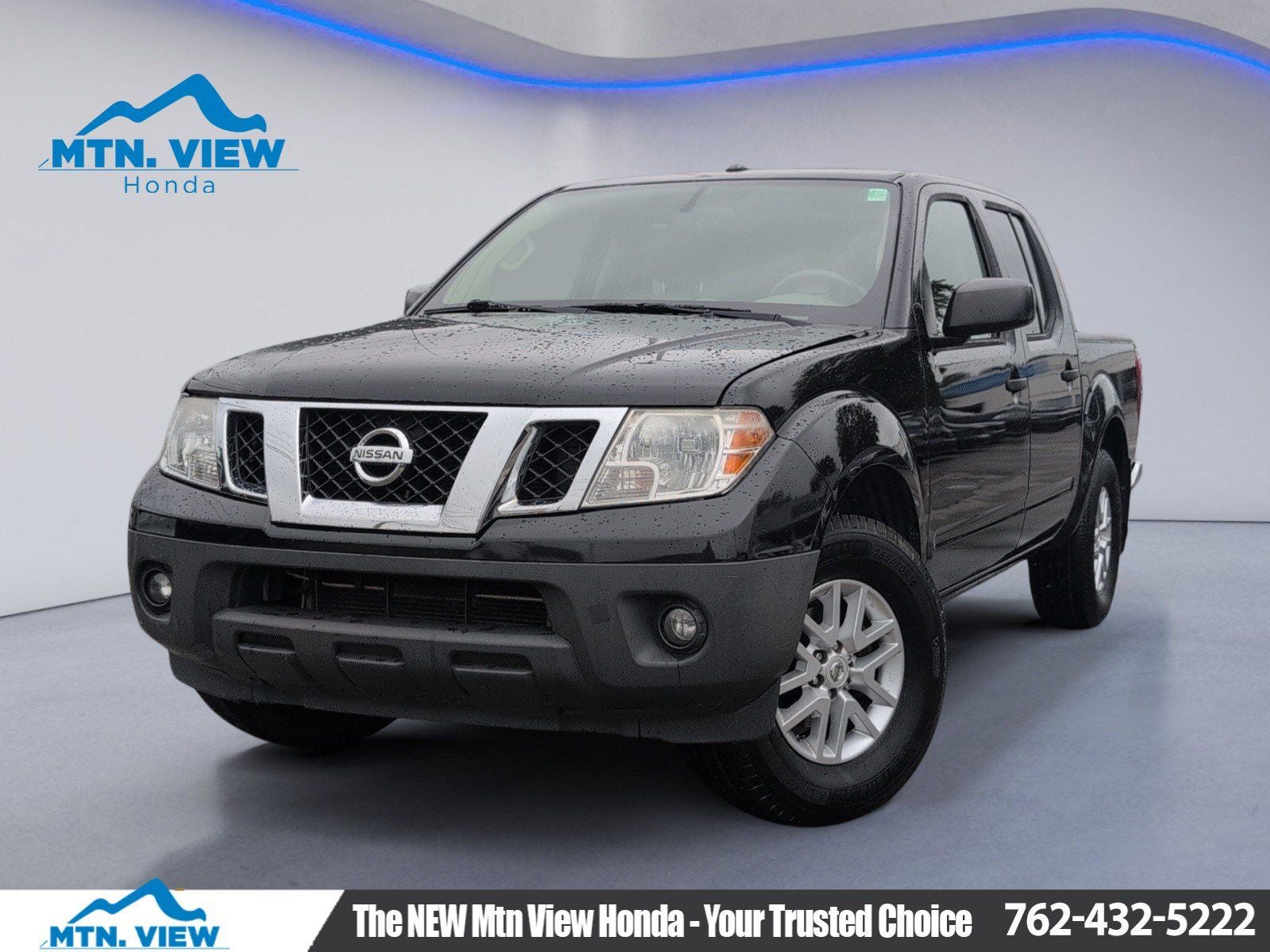 2017 Nissan Frontier SV in Magnetic Black — front three-quarter view