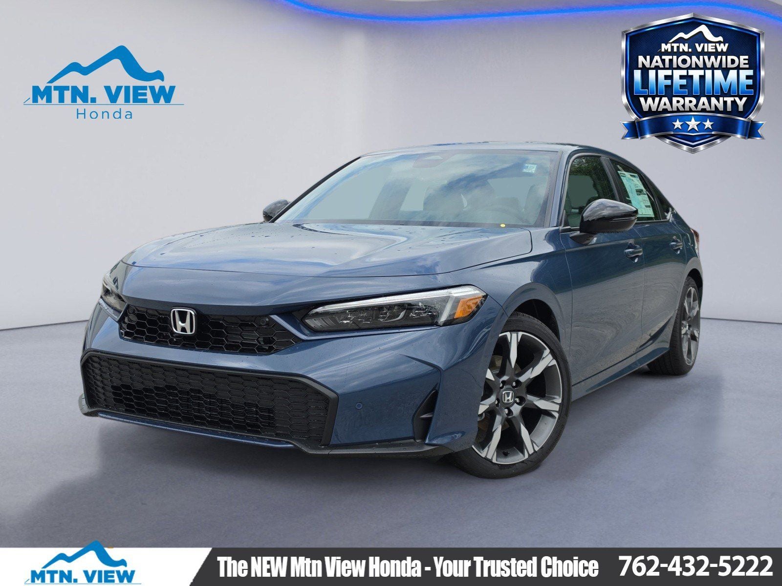 2026 Honda Civic Hybrid Sport Touring in Blue Lagoon Pearl — front three-quarter view