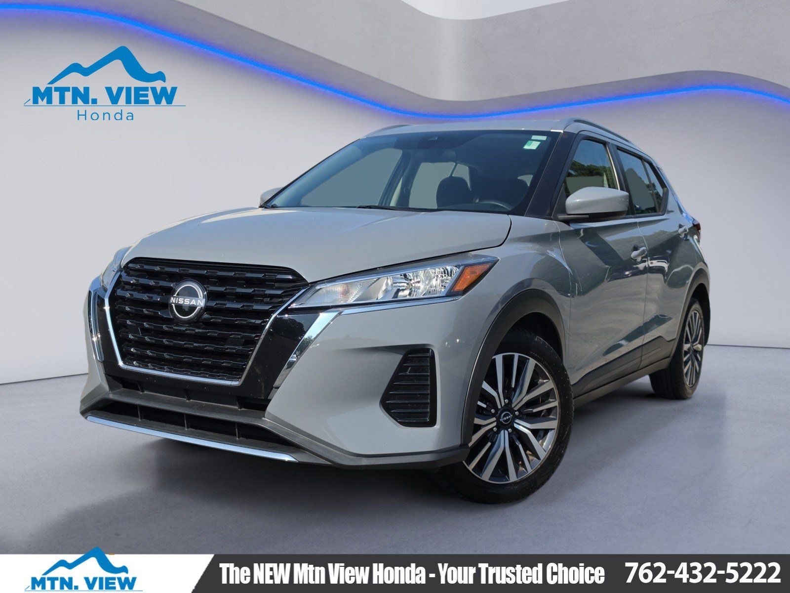 2022 Nissan Kicks SV in Boulder Gray Pearl — front three-quarter view
