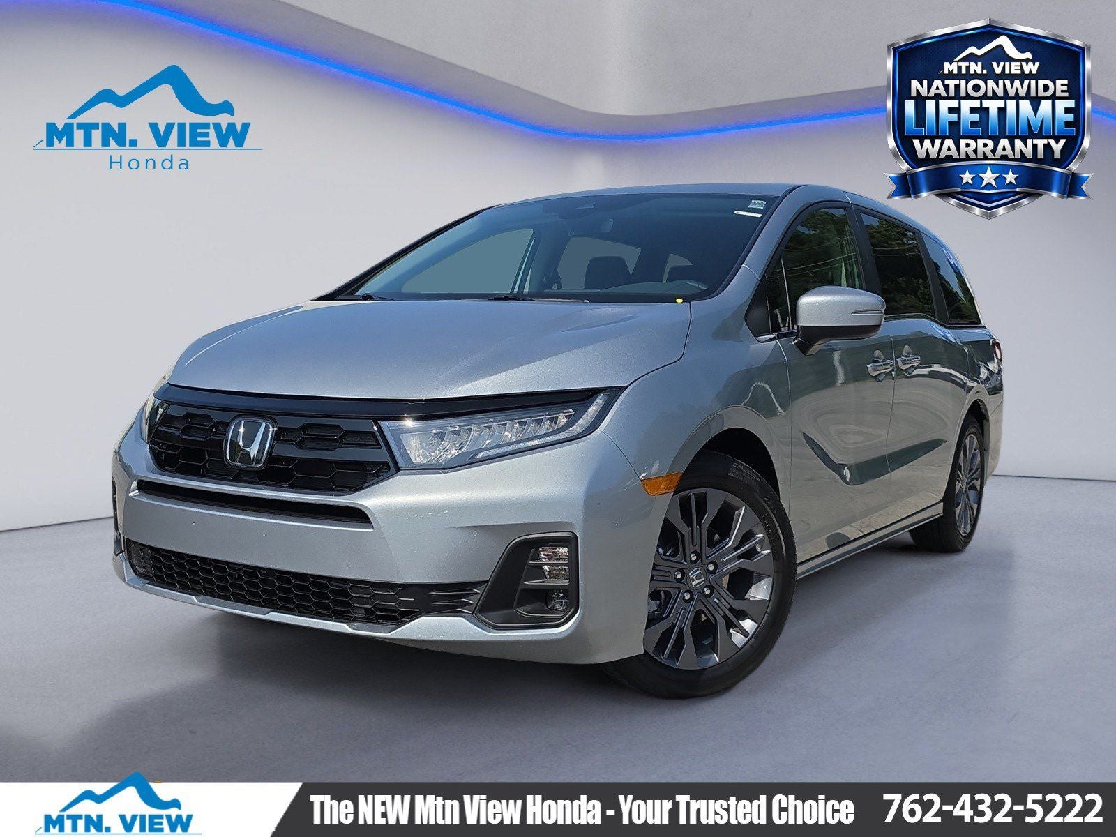2026 Honda Odyssey Touring in Solar Silver Metallic — front three-quarter view