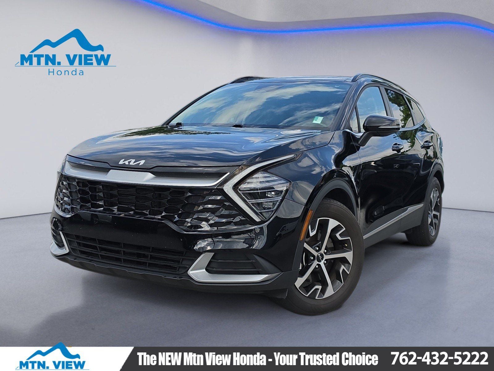 2025 Kia Sportage EX in Ebony Black — front three-quarter view