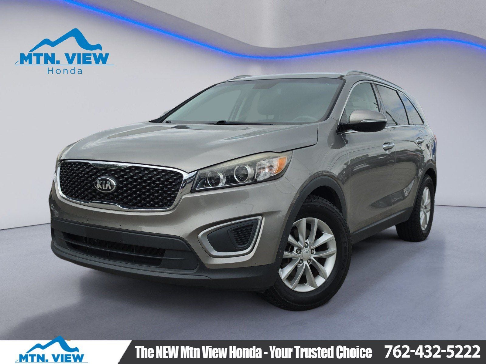 2016 Kia Sorento LX in Titanium Silver — front three-quarter view