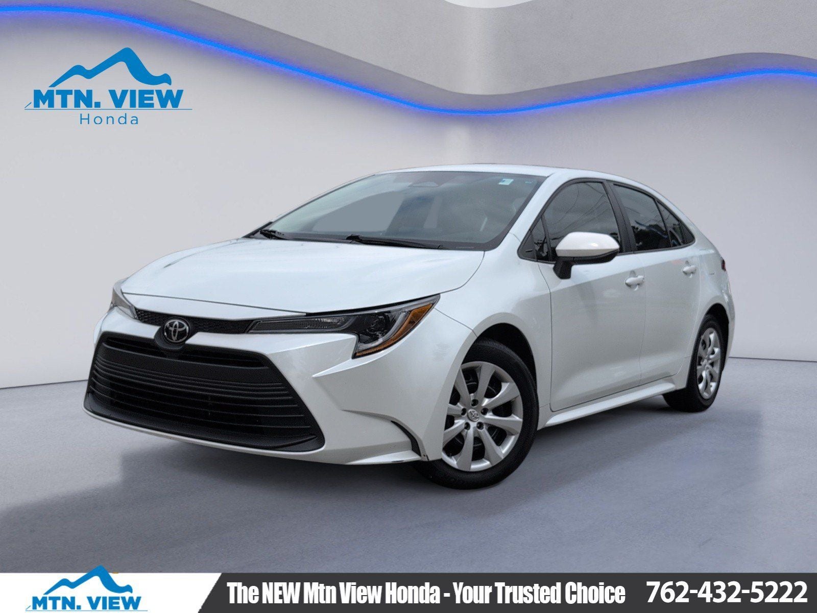 2024 Toyota Corolla LE in Pearl — front three-quarter view